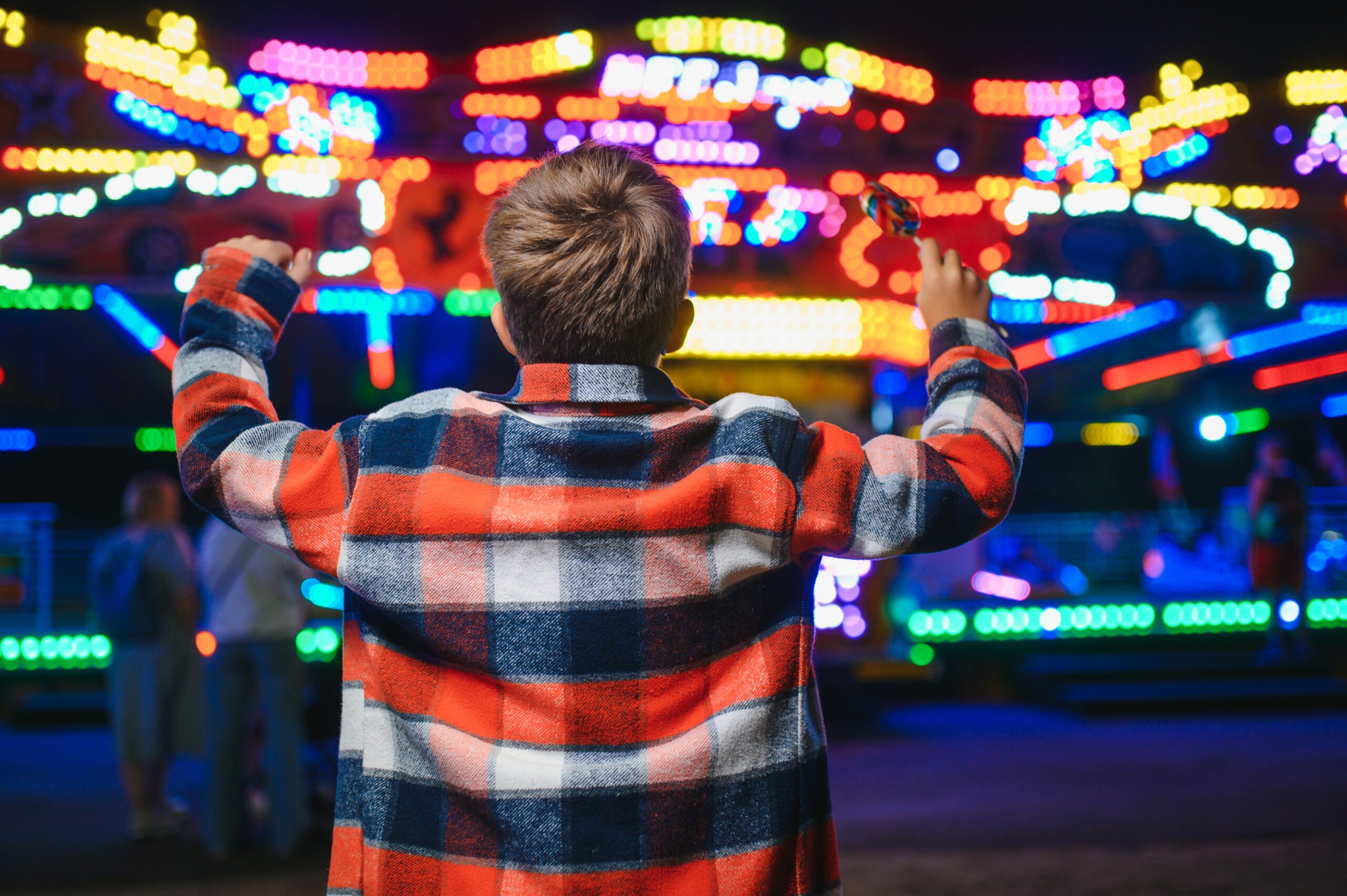 happy boy in amusement park. happy childhood concept