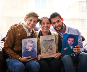 shot of a mother and sons holding old photographs 2025 04 06 08 07 32 utc