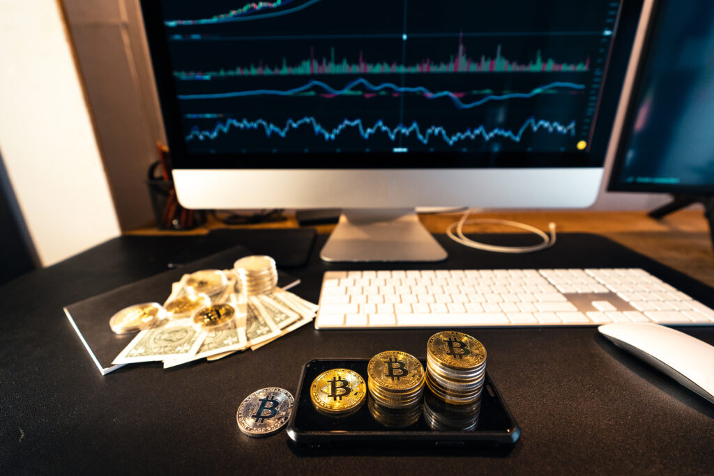 stacked bitcoins grow on the desk.