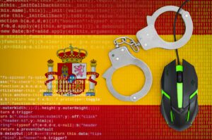 spain flag and handcuffed computer mouse. combating computer crime, hackers and piracy