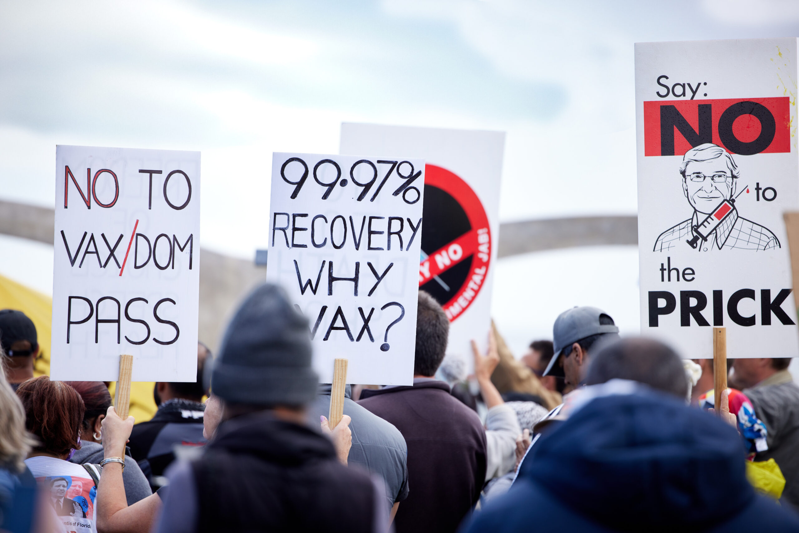 unrecognisable demonstrators holding up signs and 2025 04 06 07 53 58 utc