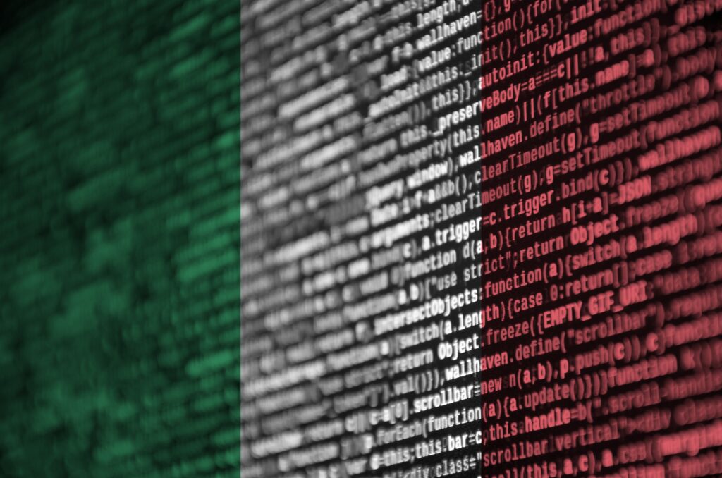italy flag is depicted on the screen with the program code. the concept of modern technology and site development