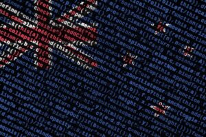 new zealand flag is depicted on the screen with the program code. the concept of modern technology and site development