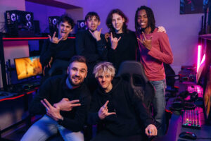 posing and smiling. team of gamers are chilling together indoors