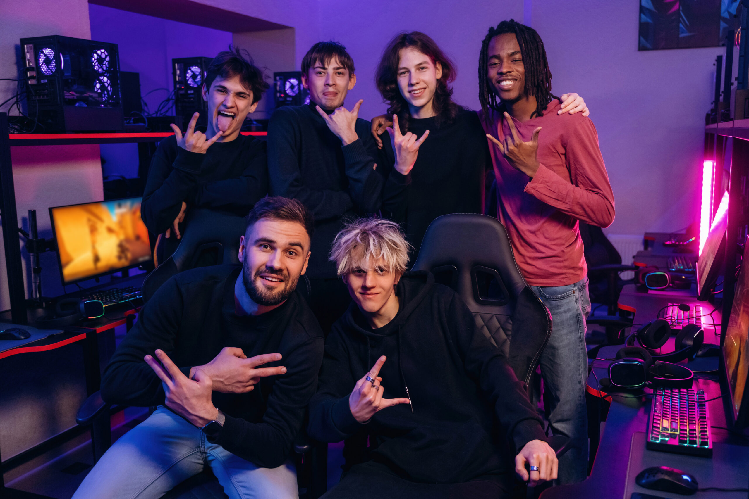 posing and smiling. team of gamers are chilling together indoors