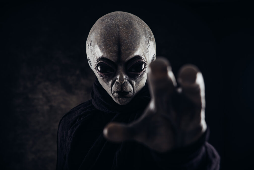alien creature has a message for humans. grey kind humanoid from