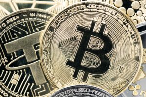 bitcoin coin on a variety of crypto coins background. top view