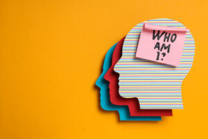 colorful paper heads and note with text on yellow background, sp