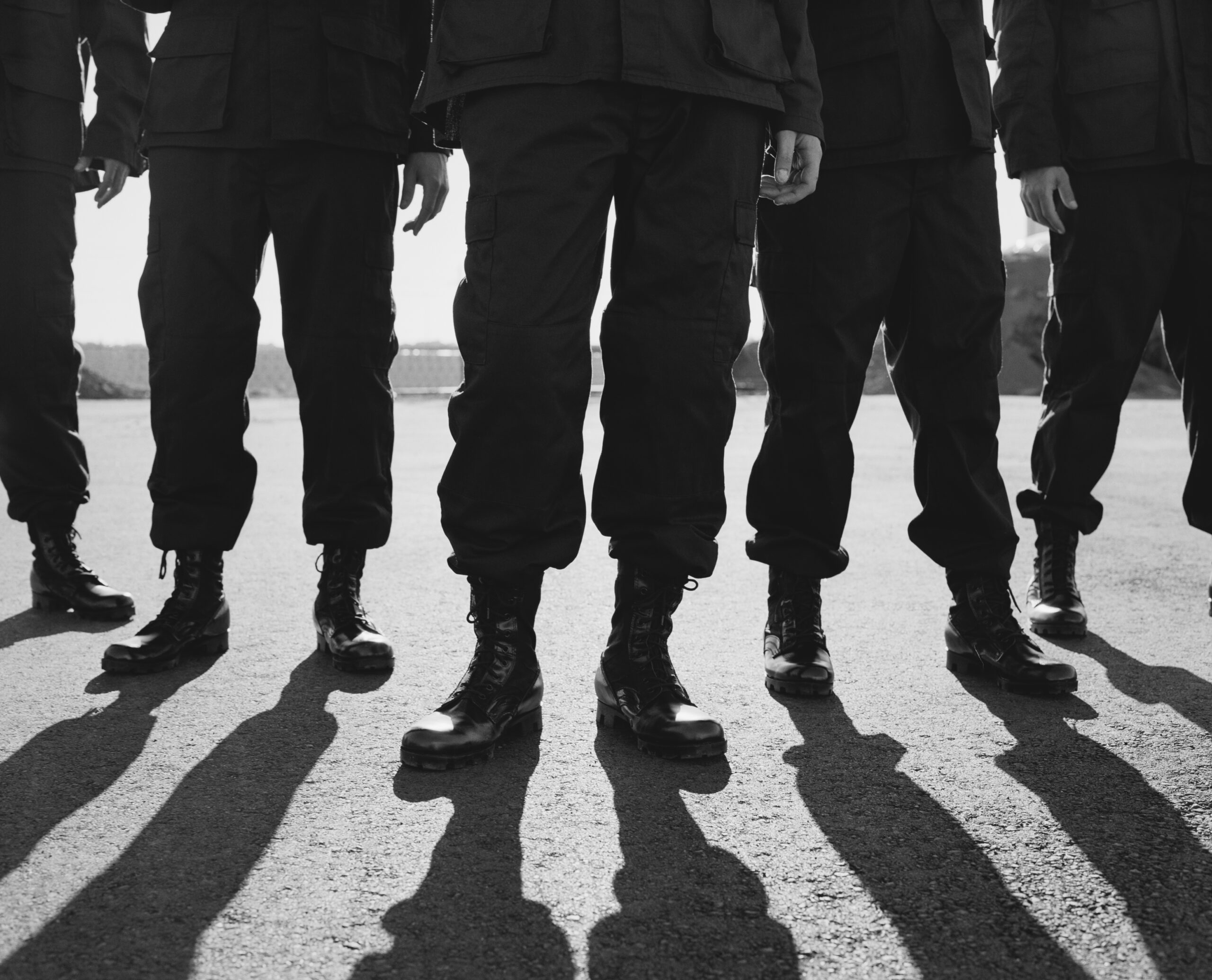 low angle view of row of men wearing military uniforms, casting shadows,low angle view of row of men wearing military uniforms, casting shadows,usa