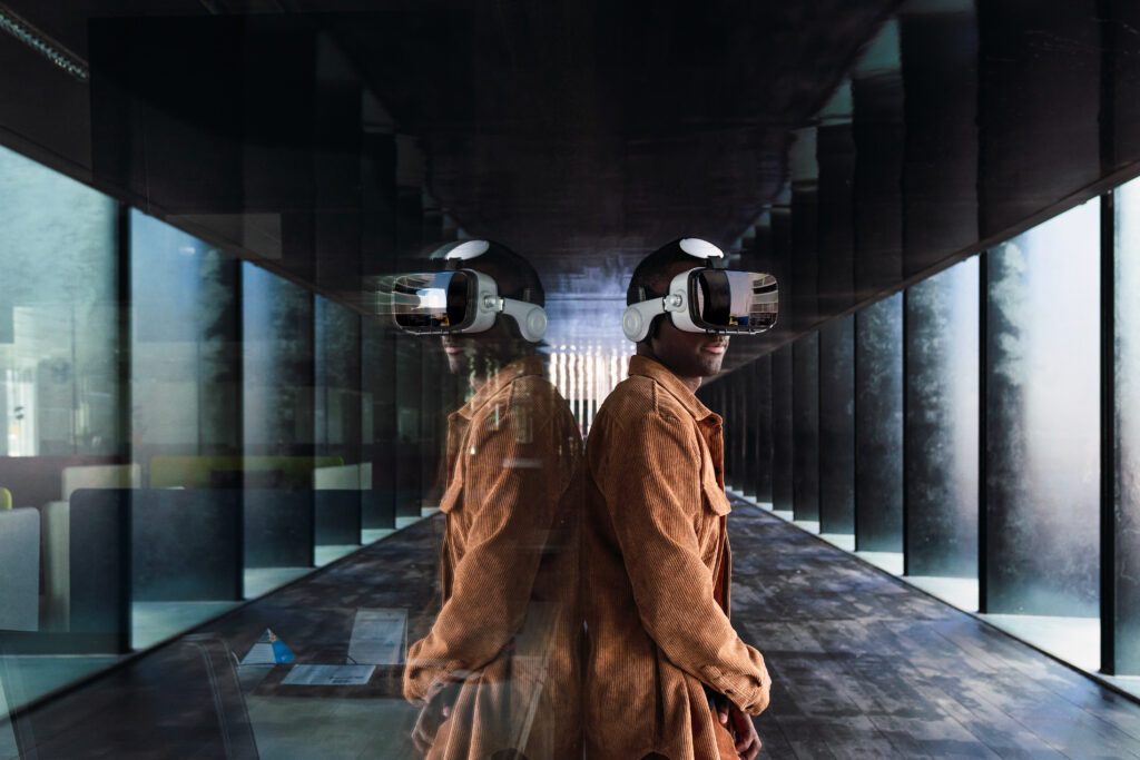 black man exploring cyberspace near glass wall
