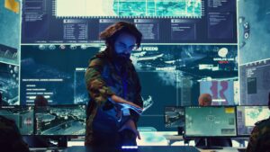 infantry unit leader studies satellite imagery on a holographic image