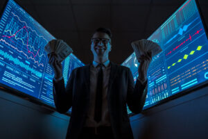 the smiling businessman holding currency in his hands